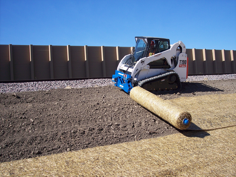 material roller laying rolls of sod